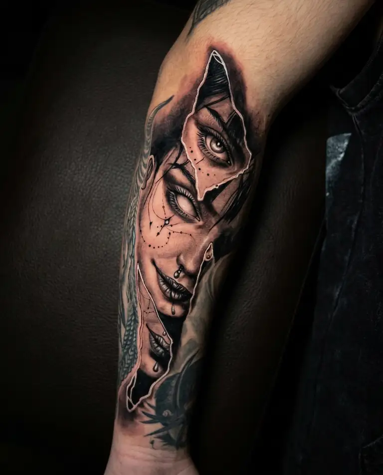 Black and grey surreal realism portrait tattoo on the forearm.