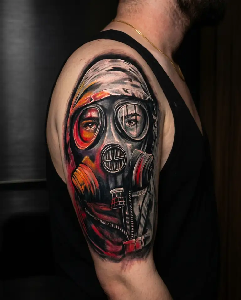 Color realism gas mask portrait tattoo on the shoulder and arm.