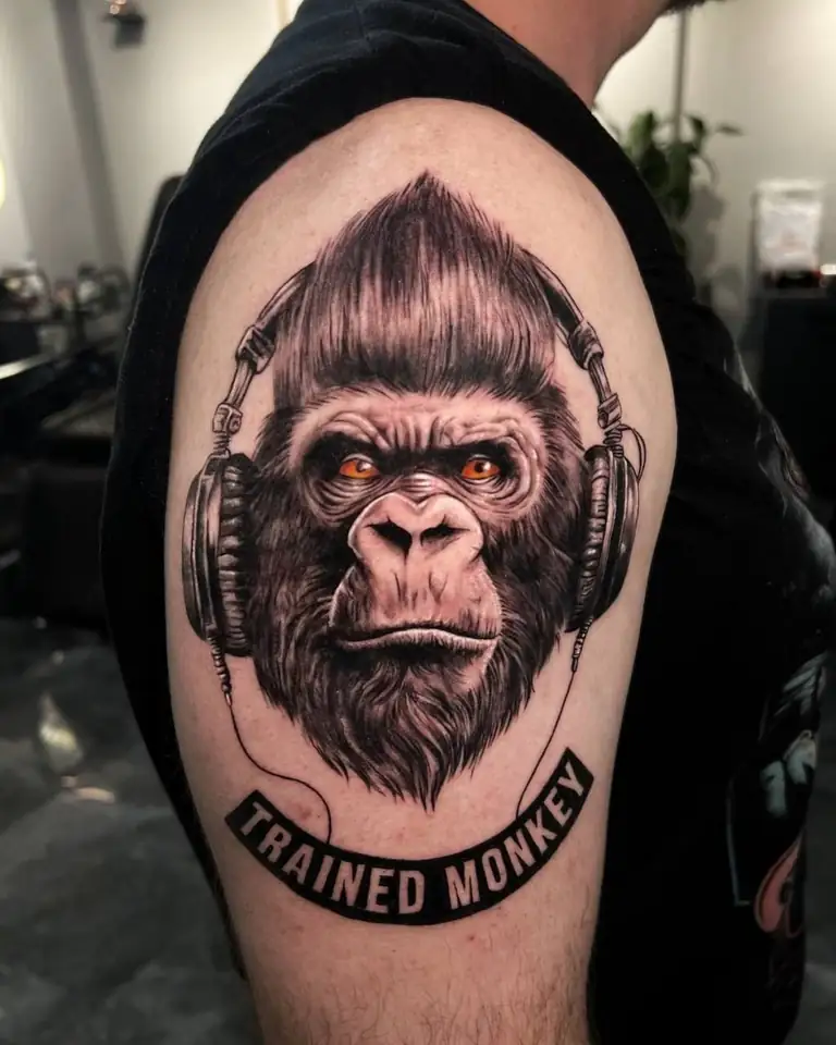 Color realism monkey with headphones tattoo at Eleven Tattoo Gallery Istanbul.