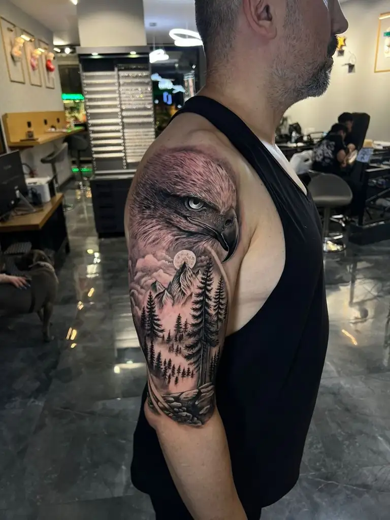 Mountain forest black grey upper arm tattoo at Eleven Tattoo Gallery Istanbul.